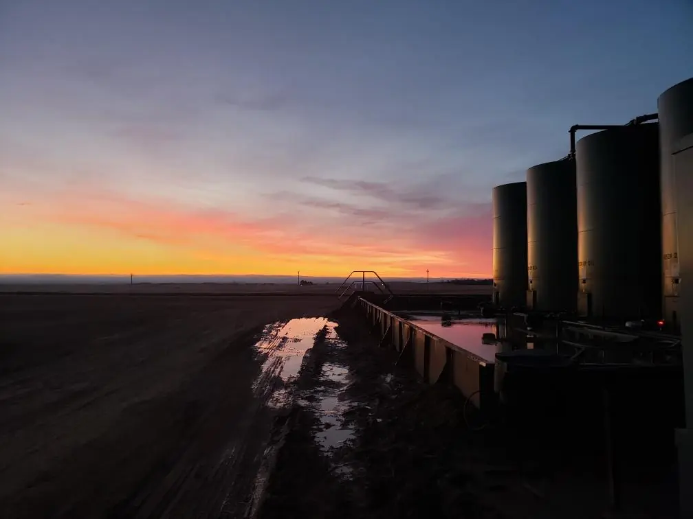 Tank battery at sunrise on a North Dakota well site